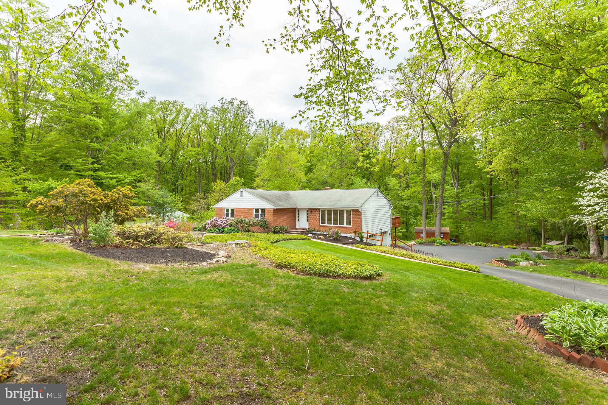 655 Chambers Rock Road Landenberg, PA 19350 - Photo 2 of 42 a front view of a house with yard and green space