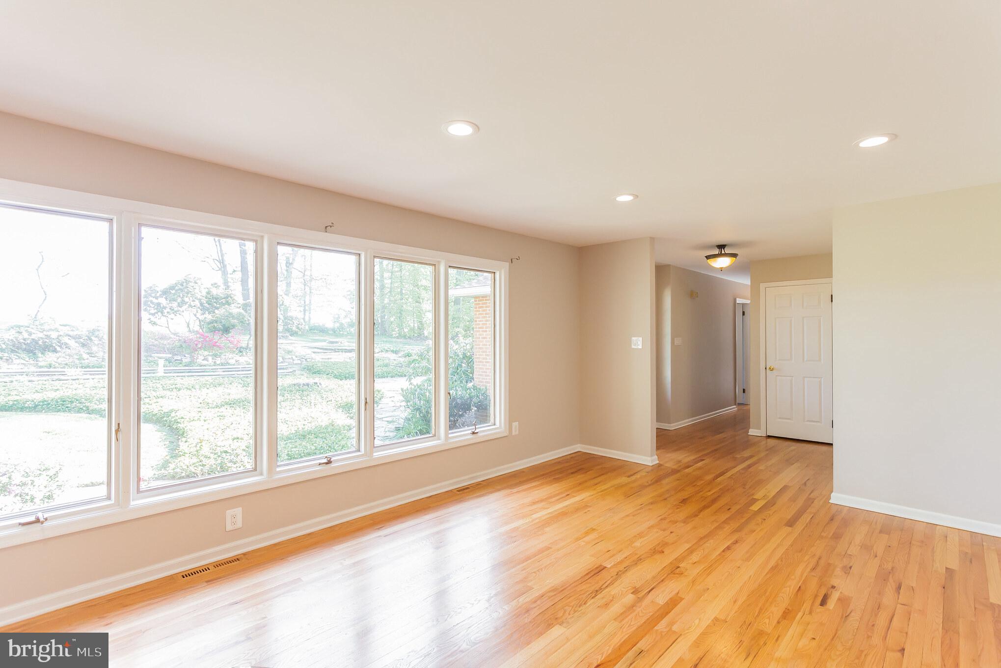 655 Chambers Rock Road Landenberg, PA 19350 - Photo 11 of 42 a view of an empty room with a window and wooden floor