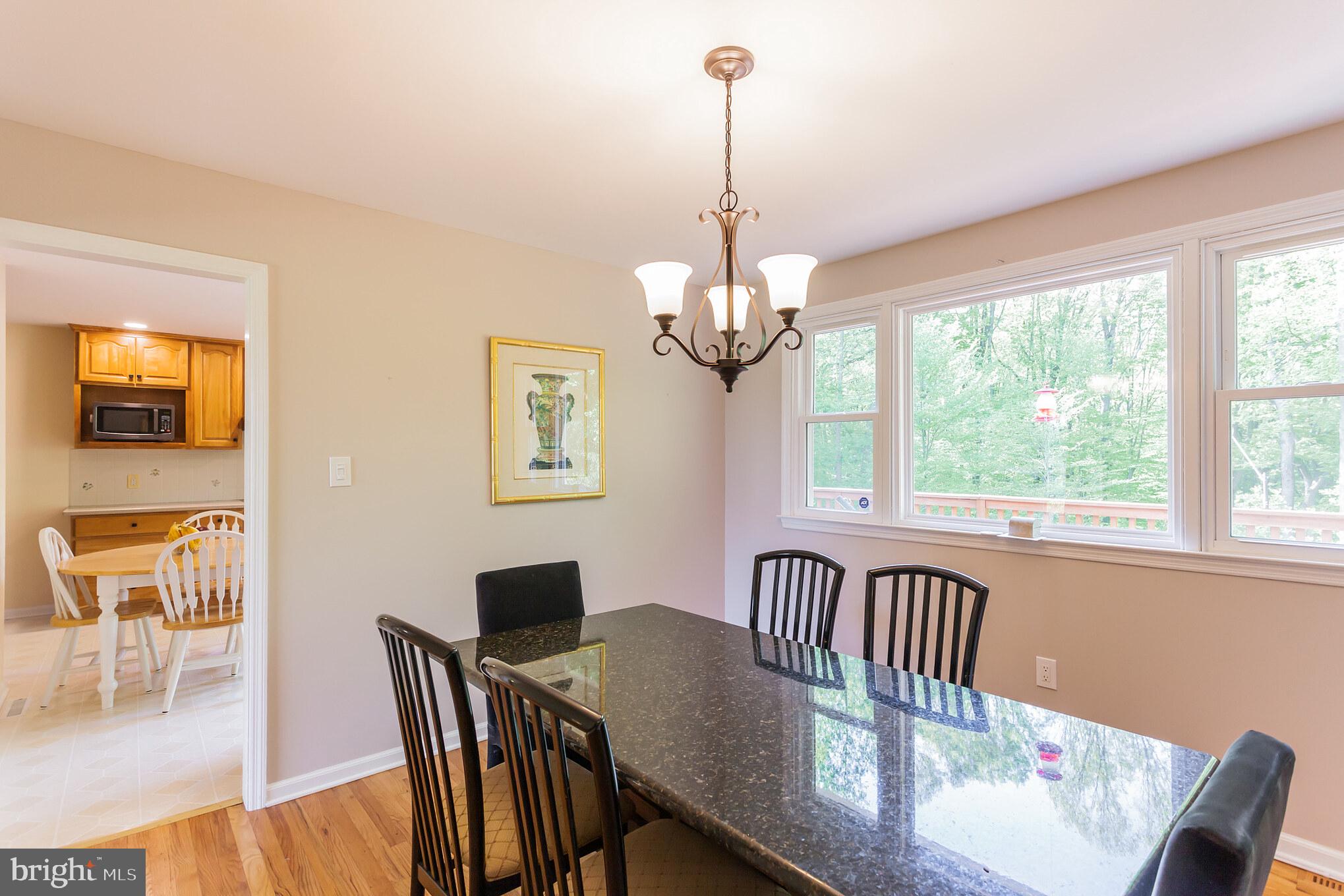 655 Chambers Rock Road Landenberg, PA 19350 - Photo 13 of 42 a view of a dining room with furniture wooden floor and chandelier