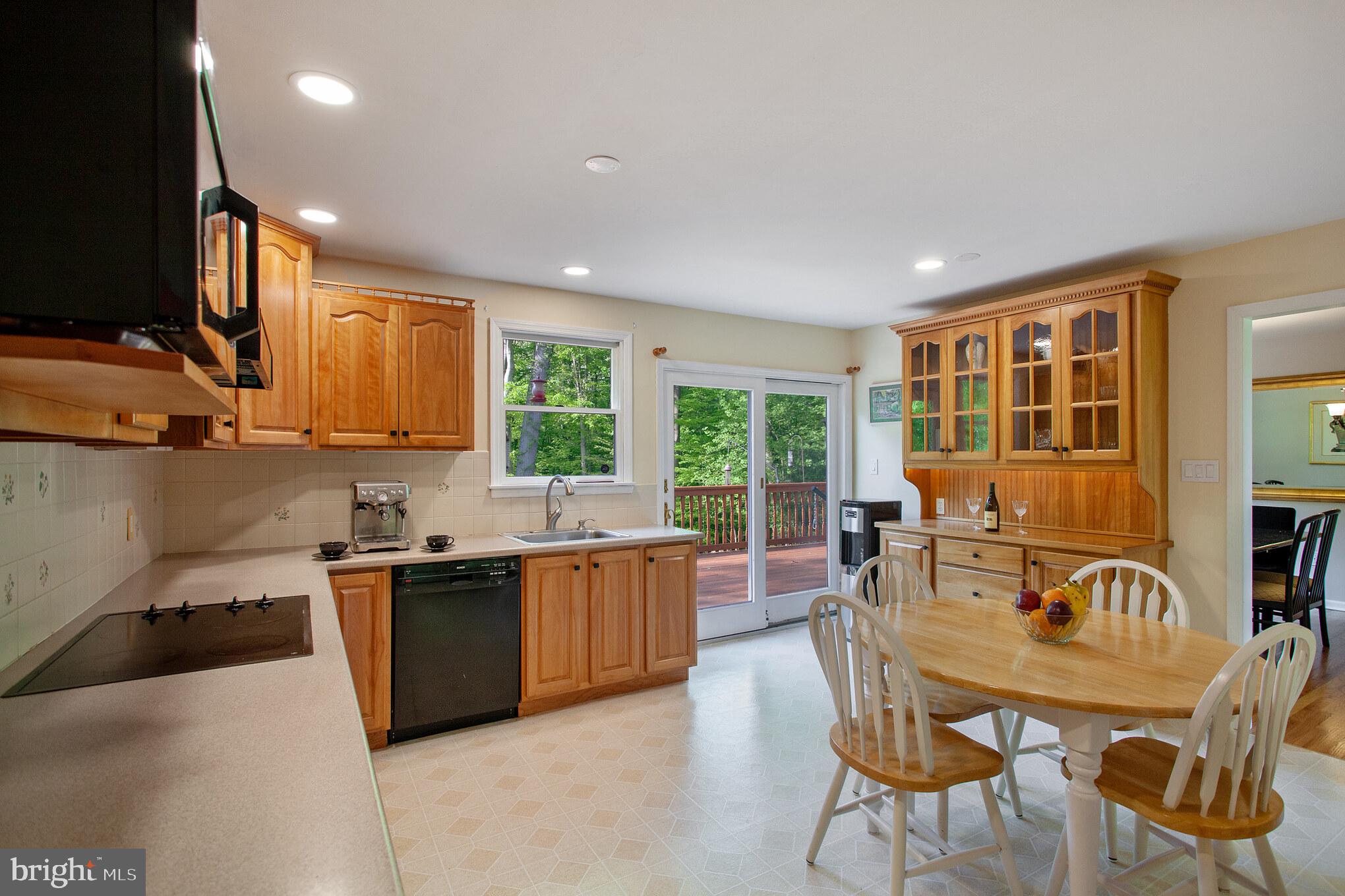 655 Chambers Rock Road Landenberg, PA 19350 - Photo 14 of 42 a view of a kitchen with kitchen island granite countertop wooden cabinets and stainless steel appliances