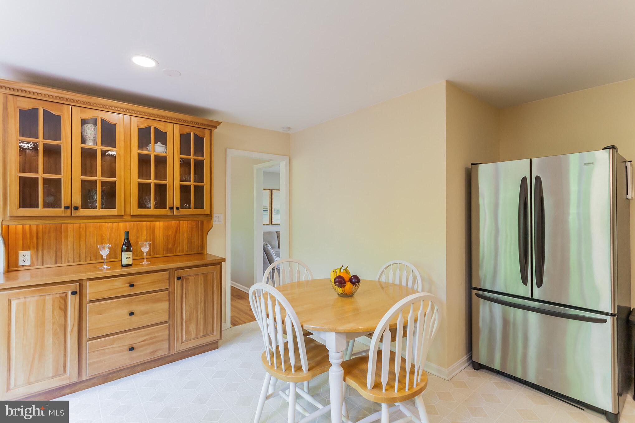 655 Chambers Rock Road Landenberg, PA 19350 - Photo 15 of 42 a kitchen with stainless steel appliances a refrigerator and wooden cabinets