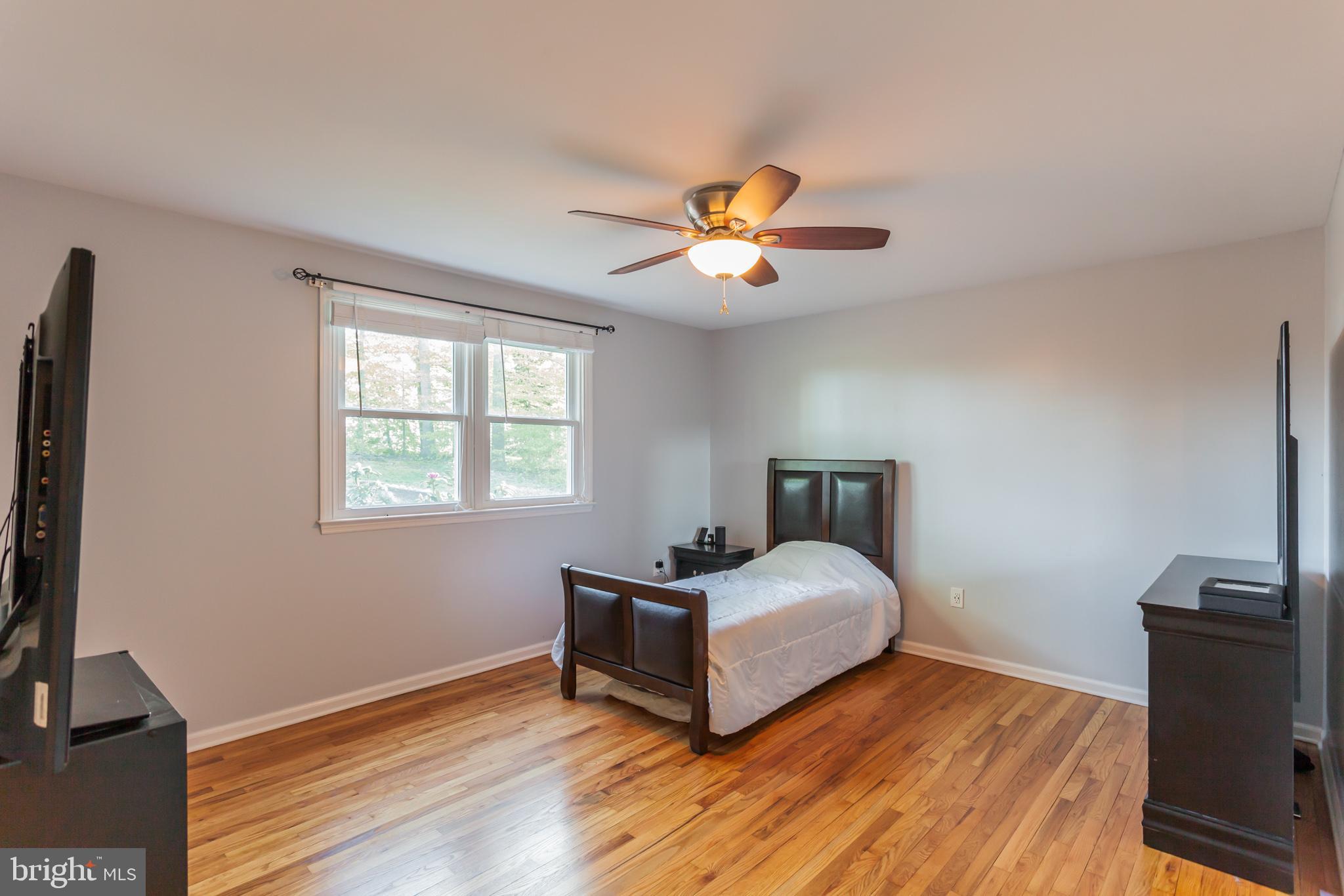 655 Chambers Rock Road Landenberg, PA 19350 - Photo 23 of 42 a bedroom with a bed and a tv