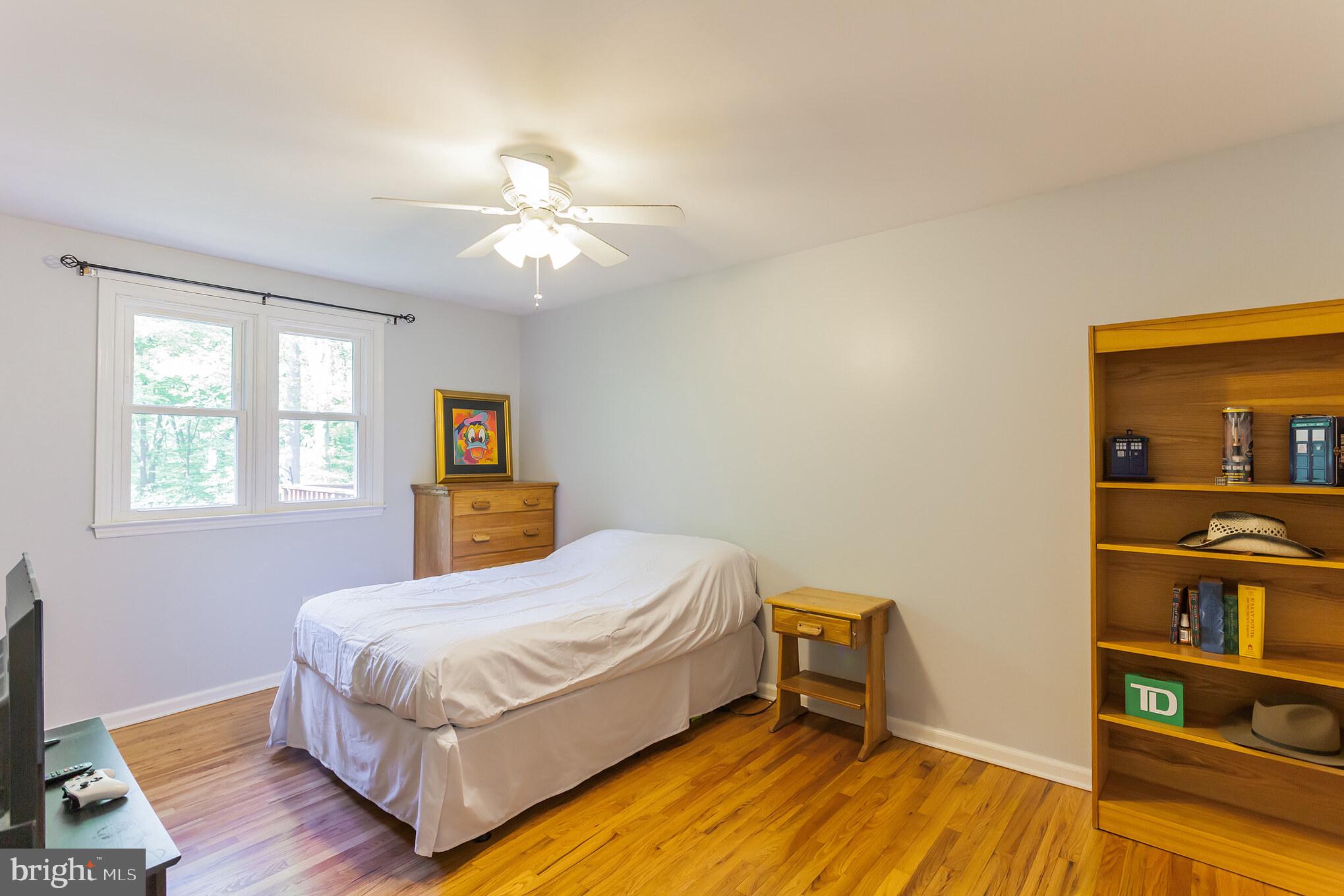 655 Chambers Rock Road Landenberg, PA 19350 - Photo 27 of 42 a bedroom with a bed and a bookshelf