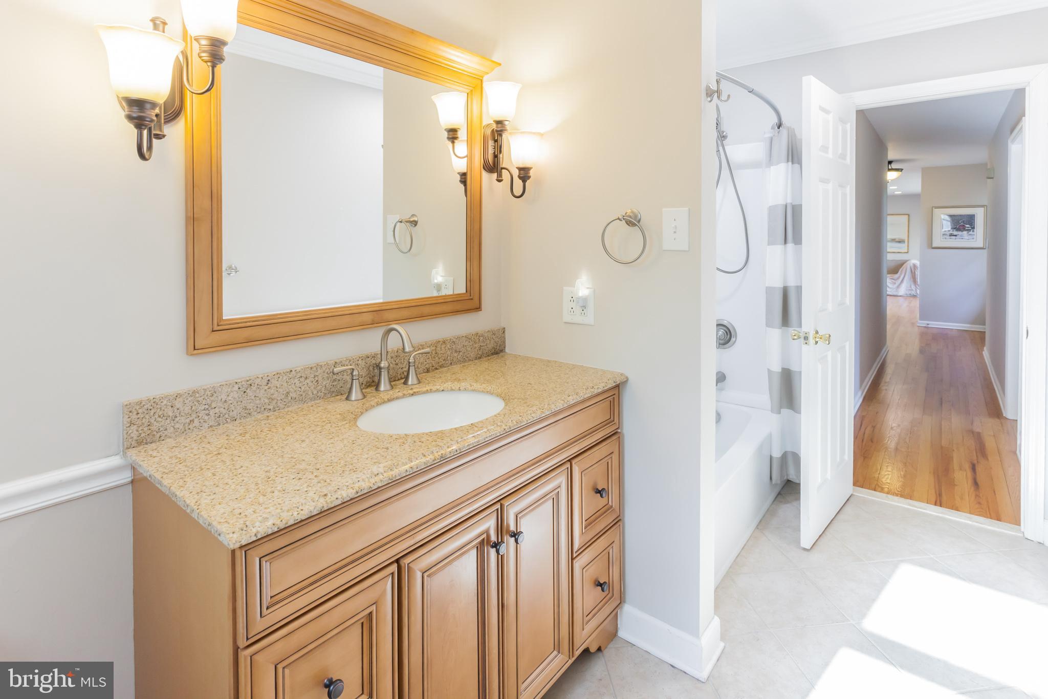 655 Chambers Rock Road Landenberg, PA 19350 - Photo 28 of 42 a bathroom with a sink a vanity and a mirror