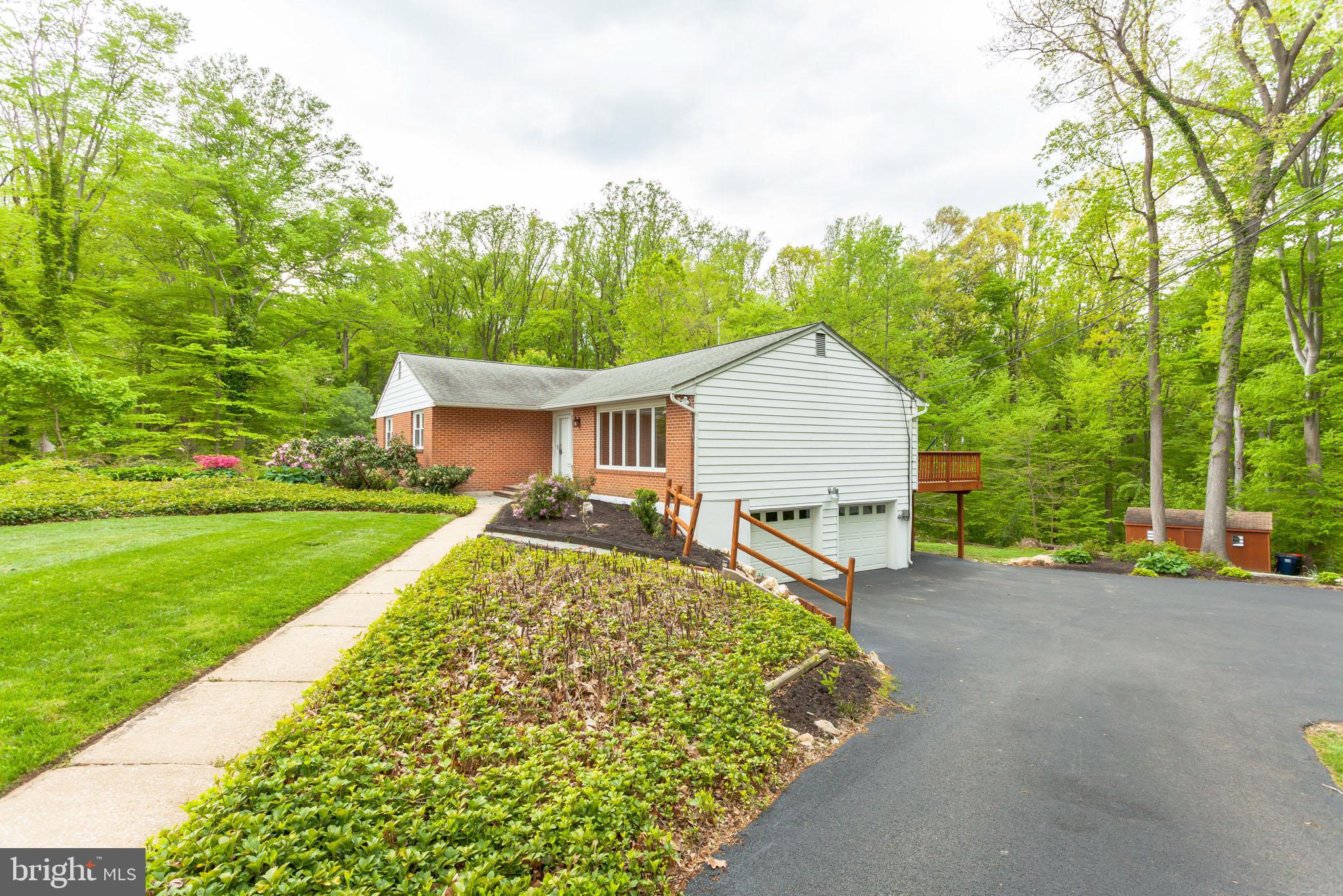 655 Chambers Rock Road Landenberg, PA 19350 - Photo 4 of 42 a view of a house with backyard and garden