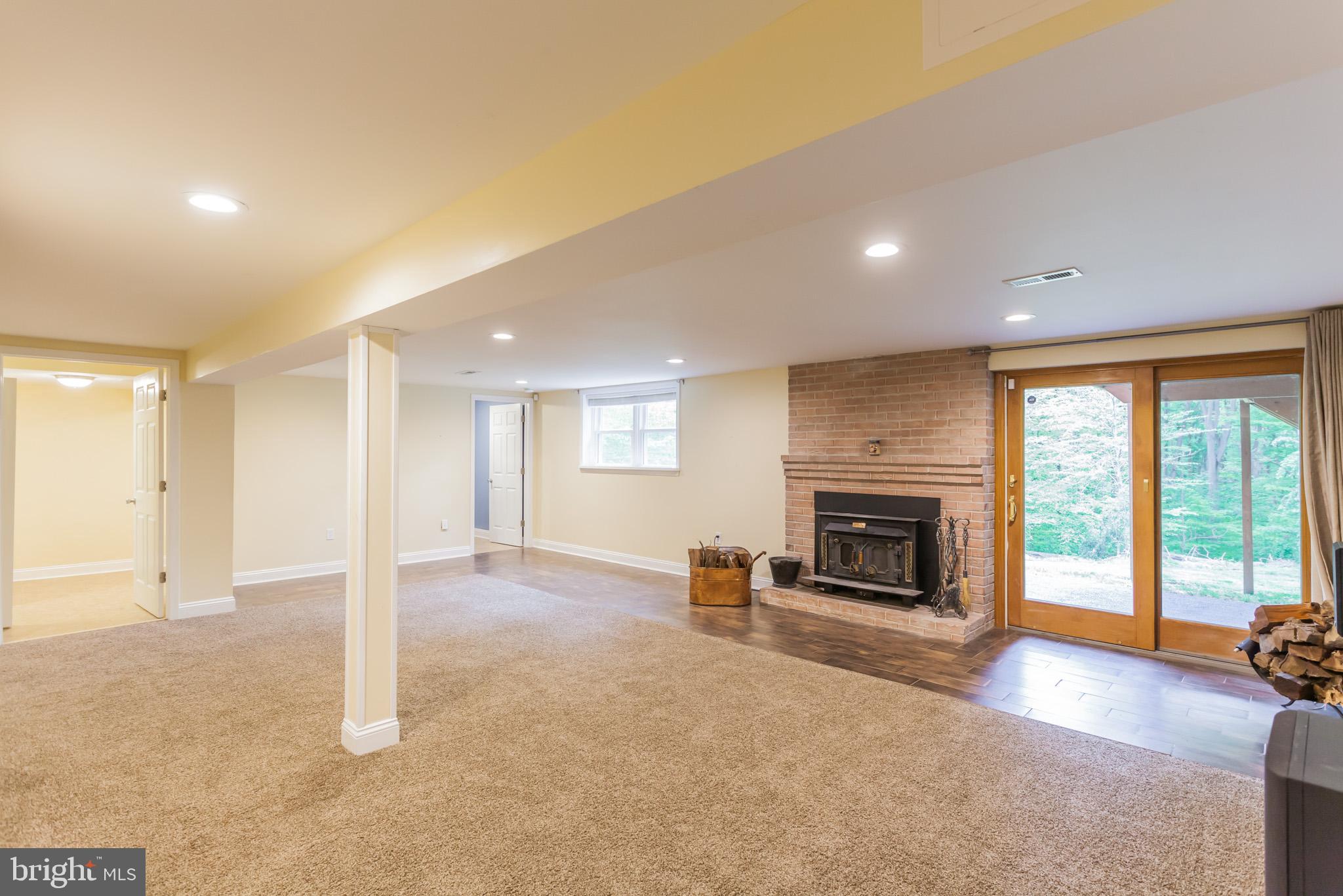 655 Chambers Rock Road Landenberg, PA 19350 - Photo 31 of 42 an empty room with furniture and a fireplace