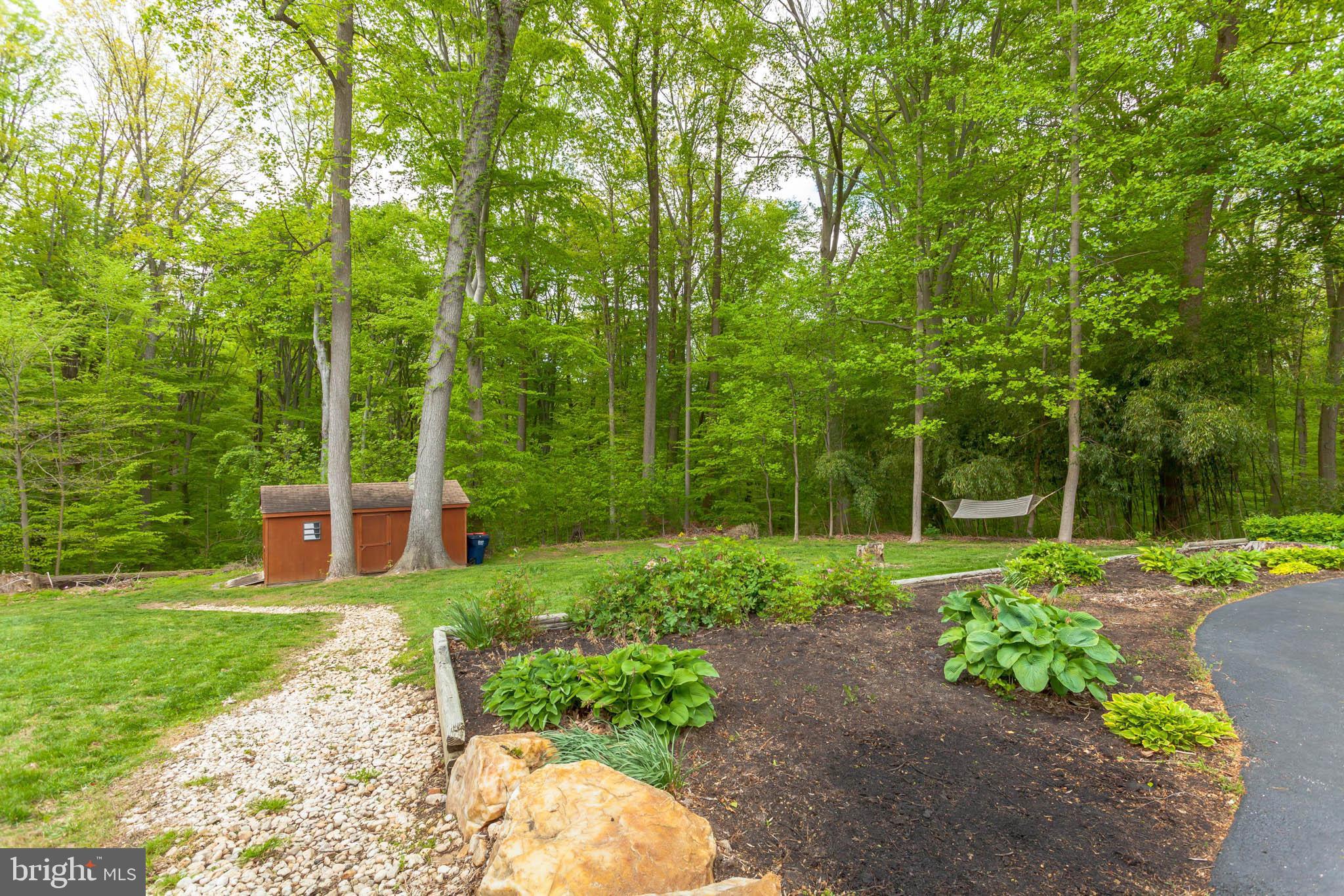 655 Chambers Rock Road Landenberg, PA 19350 - Photo 39 of 42 a view of a backyard with large trees