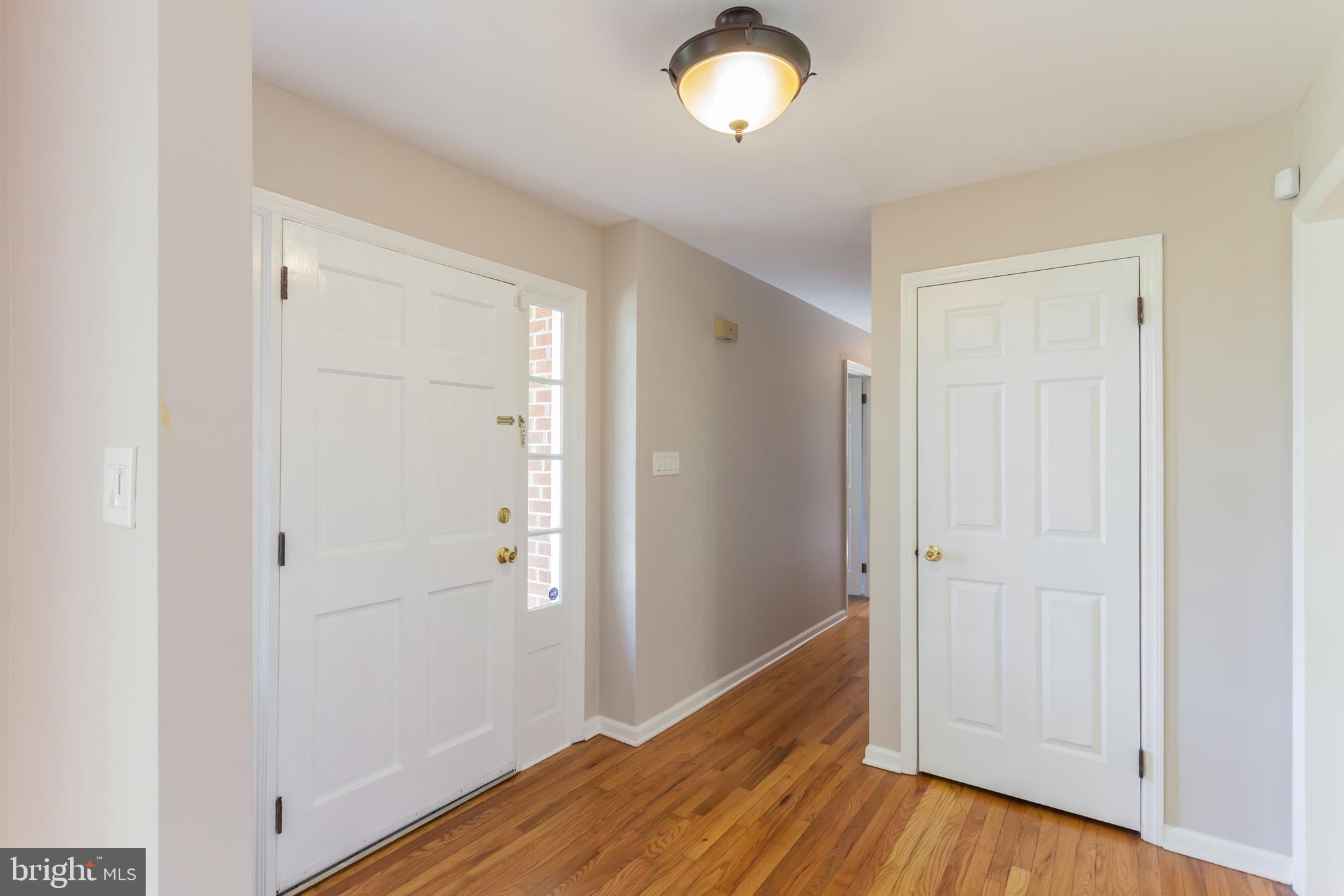 655 Chambers Rock Road Landenberg, PA 19350 - Photo 7 of 42 a view of a hallway with wooden floor
