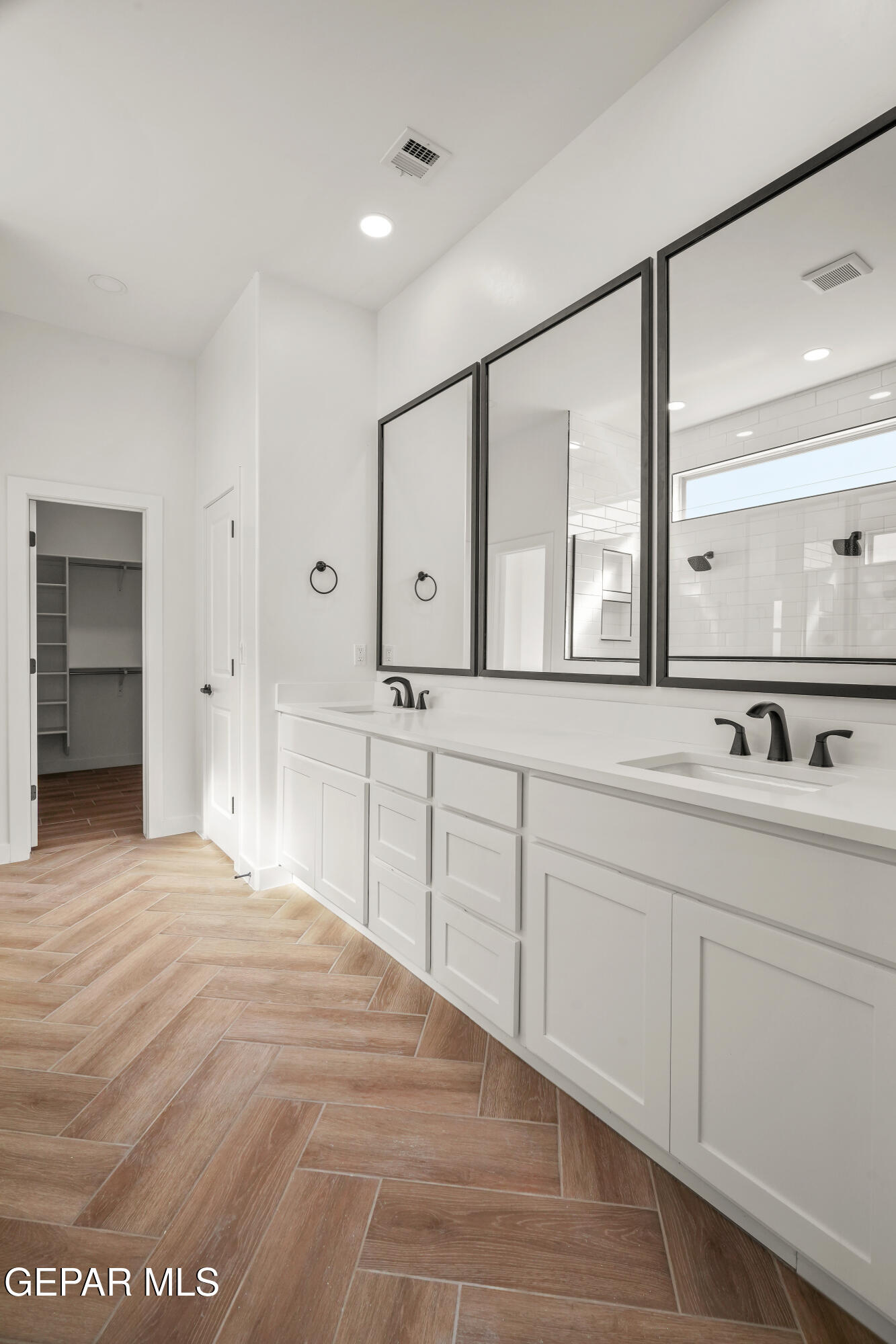 15221 Expectation El Paso, TX 79938 - Photo 32 of 38 a bathroom with a sink and a large mirror