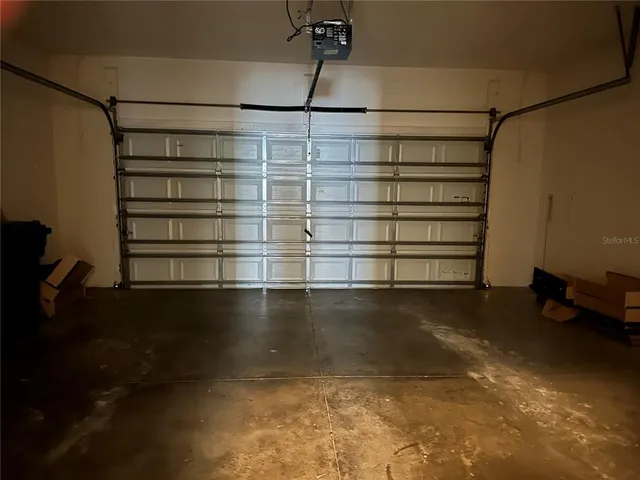a view of a room with shelves on the wall