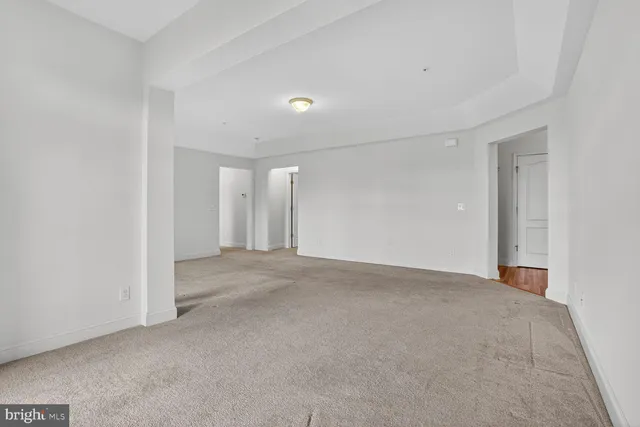 a kitchen with stainless steel appliances granite countertop a refrigerator and a stove
