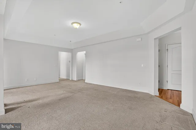 a view of a kitchen with a sink and a refrigerator