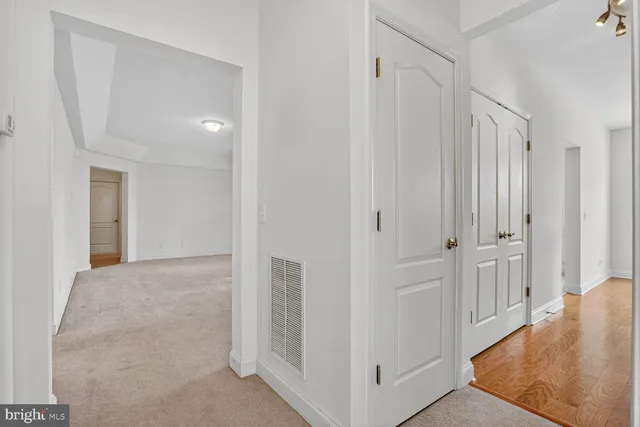 a white toilet sitting next to a bath tub