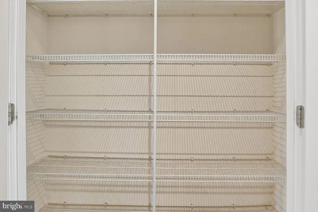a dining room with furniture a chandelier and wooden floor