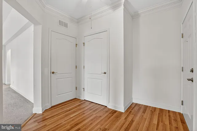a view of an empty room and glass door