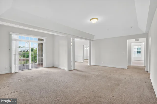 a view of livingroom with furniture window and front door