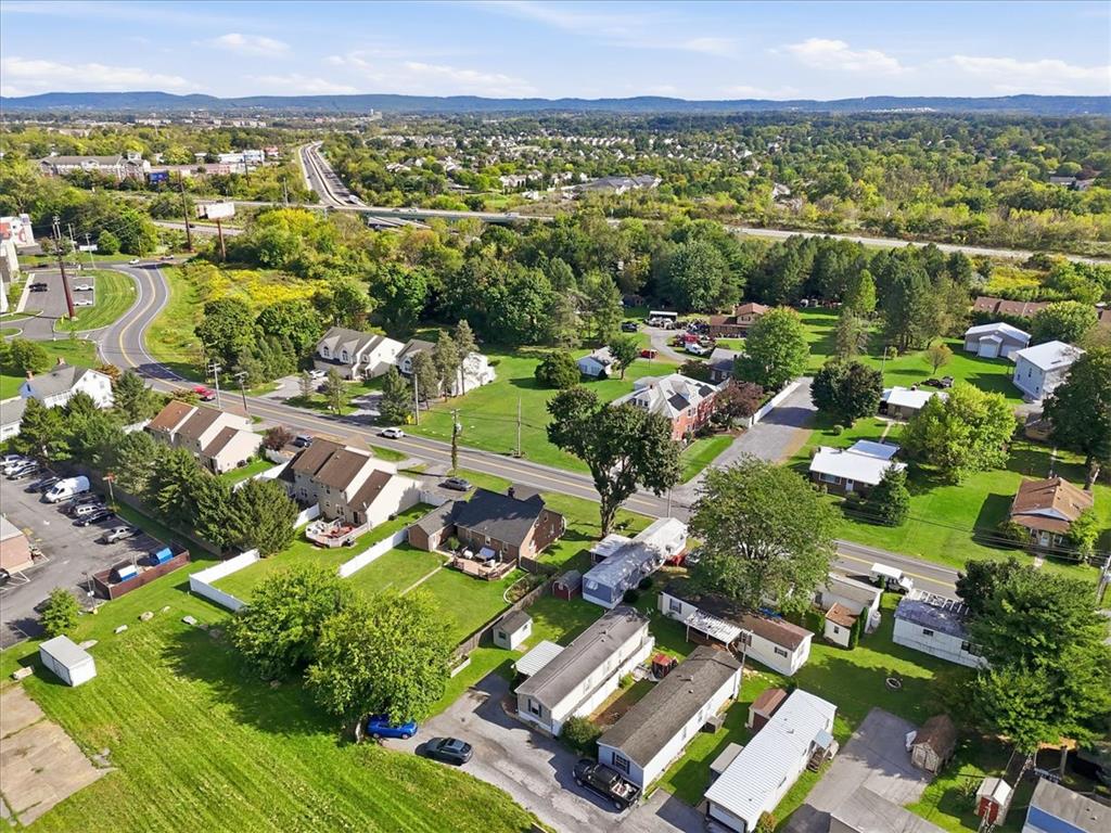 6129 Memorial Road Allentown, PA 18104 - Photo 42 of 46 An aerial perspective captures the peaceful neighborhood surrounded by lush greenery and rolling hills.