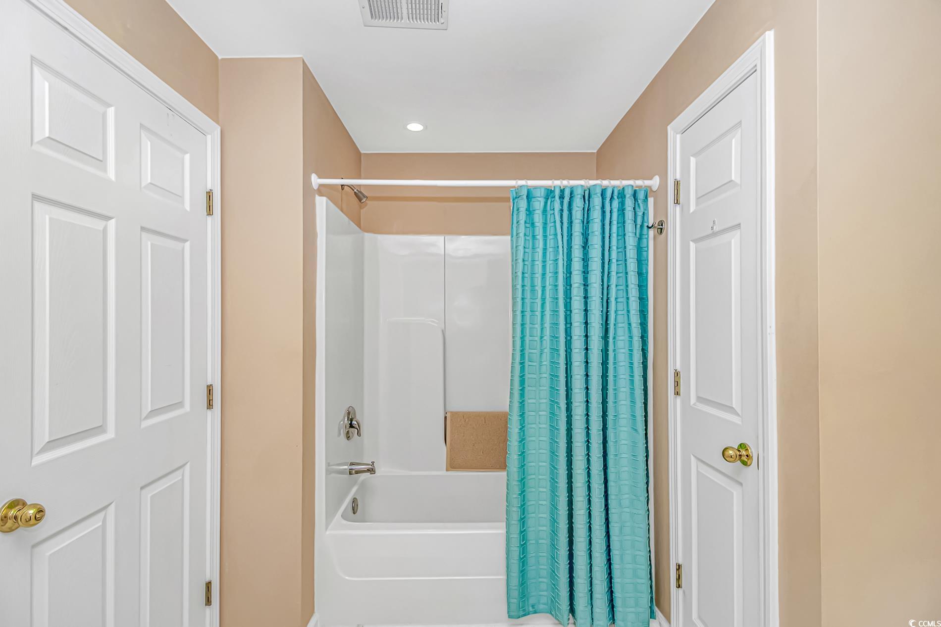 4366 Rivergate Lane, Unit 306 Little River, SC 29566 - Photo 15 of 32 Full bathroom with shower / bath combo with shower curtain and recessed lighting