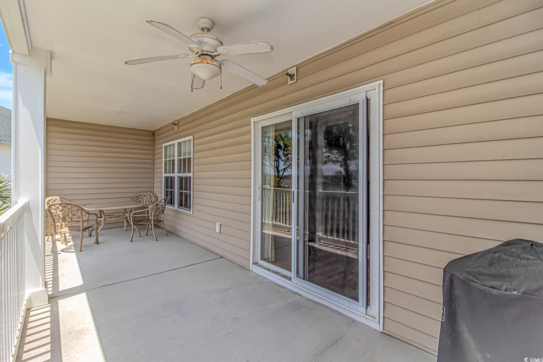 4366 Rivergate Lane, Unit 306 Little River, SC 29566 - Photo 26 of 32 View of patio with a ceiling fan