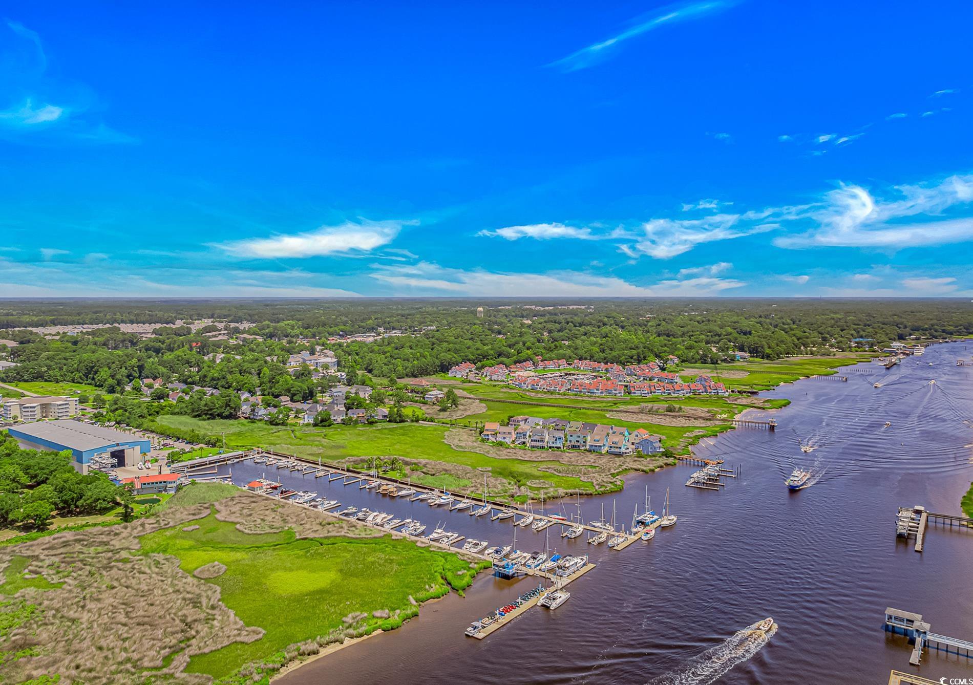 4366 Rivergate Lane, Unit 306 Little River, SC 29566 - Photo 30 of 32 Drone / aerial view of a large body of water and numerous boat docks