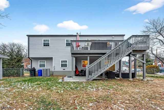 a view of a house with wooden deck