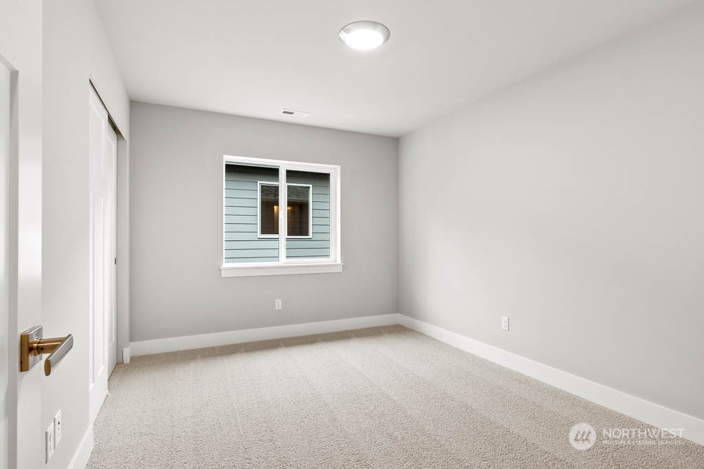 21423 Royal Anne Road, Unit RM1 Bothell, WA 98021 - Photo 12 of 26 an empty room with a window