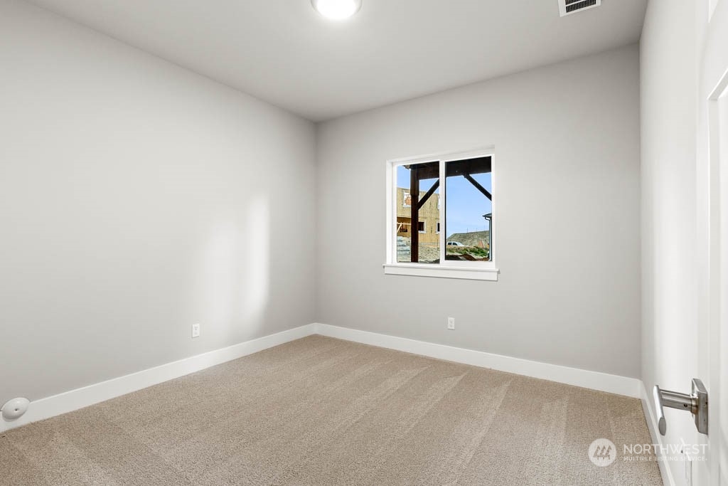 21423 Royal Anne Road, Unit RM1 Bothell, WA 98021 - Photo 16 of 26 an empty room with a window