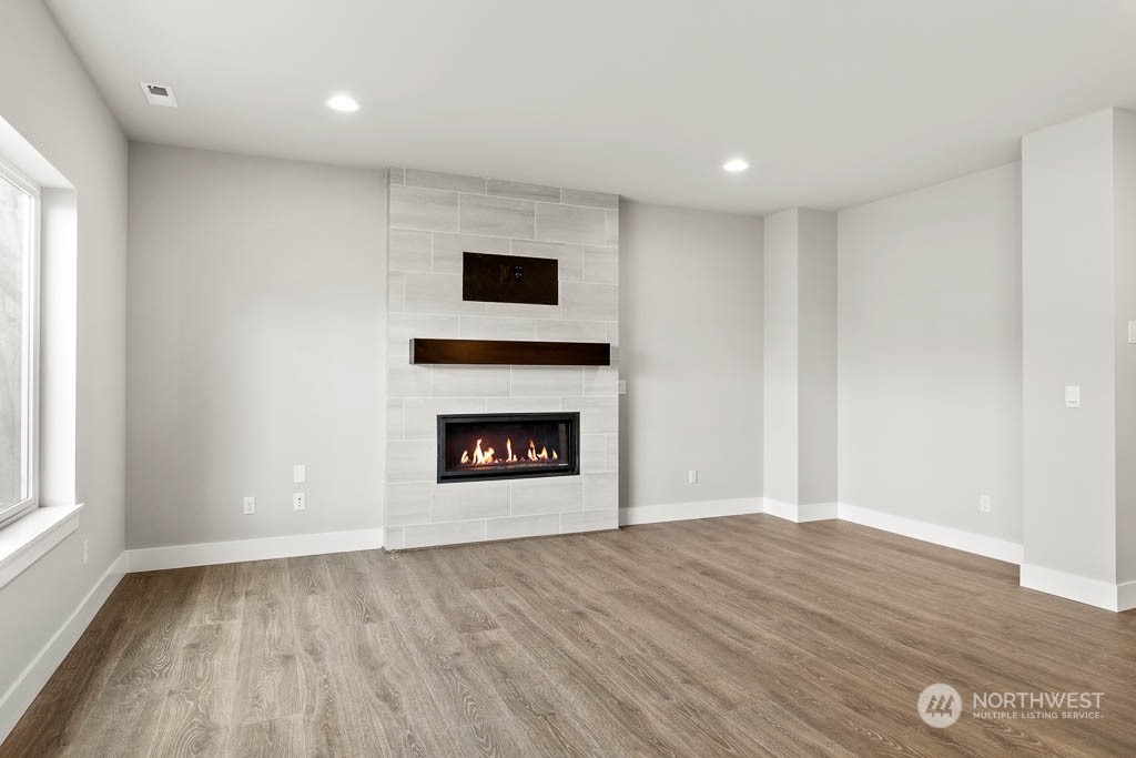 21423 Royal Anne Road, Unit RM1 Bothell, WA 98021 - Photo 2 of 26 wooden floor in an empty room with a window