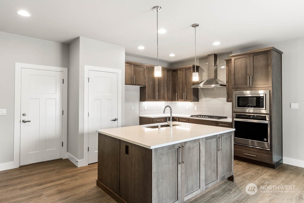 21423 Royal Anne Road, Unit RM1 Bothell, WA 98021 - Photo 24 of 26 a kitchen with a sink stove and refrigerator