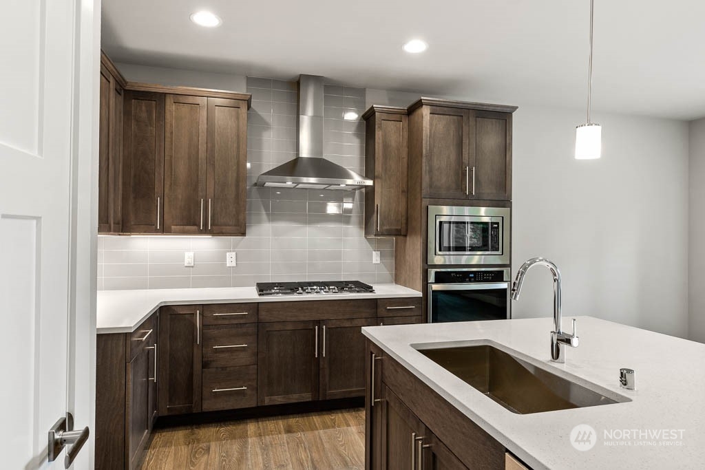 21423 Royal Anne Road, Unit RM1 Bothell, WA 98021 - Photo 3 of 26 a kitchen that has a sink and a stove