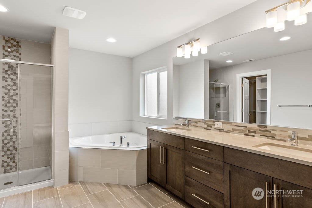 21423 Royal Anne Road, Unit RM1 Bothell, WA 98021 - Photo 8 of 26 a bathroom with a sink double vanity granite tub shower and a mirror