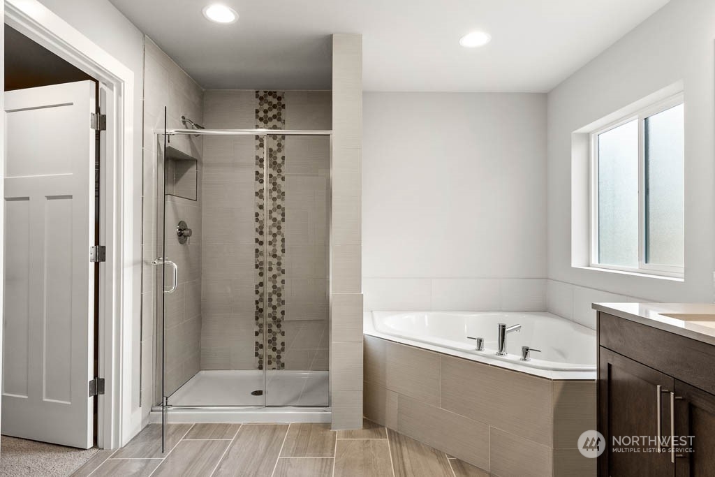 21423 Royal Anne Road, Unit RM1 Bothell, WA 98021 - Photo 10 of 26 a bathroom with a bathtub and a shower