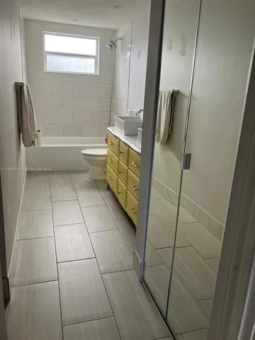 a bathroom with a bathtub and toilet