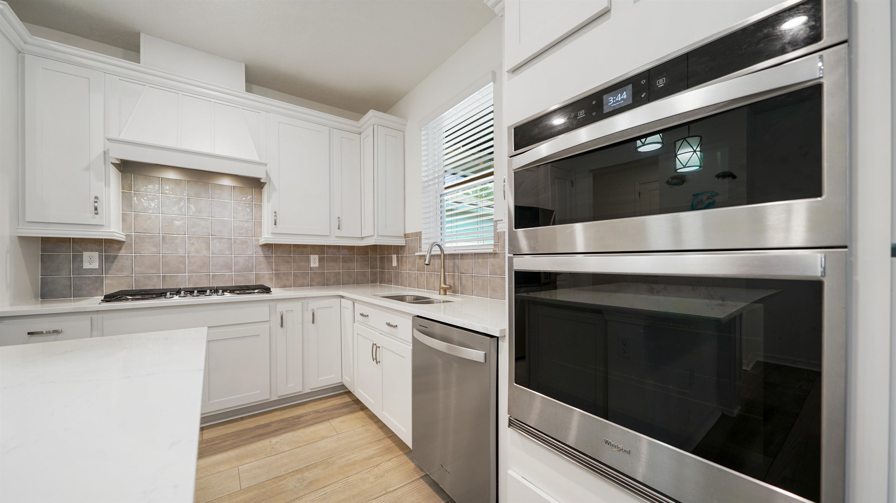 314 Red Barn Road St. Augustine, FL 32092 - Photo 13 of 45 a kitchen with stainless steel appliances a stove microwave and cabinets