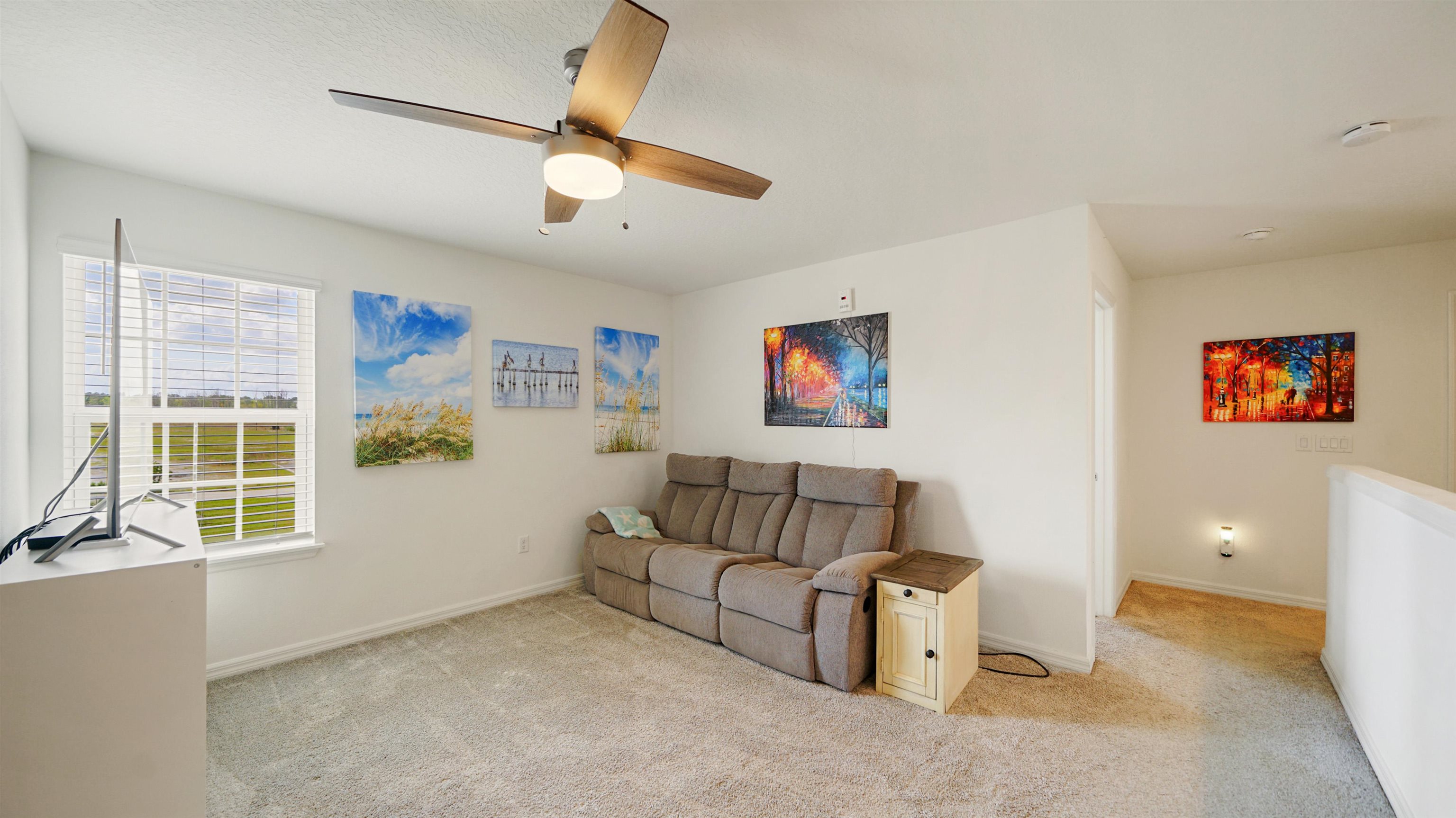 314 Red Barn Road St. Augustine, FL 32092 - Photo 19 of 45 a living room with furniture and a flat screen tv