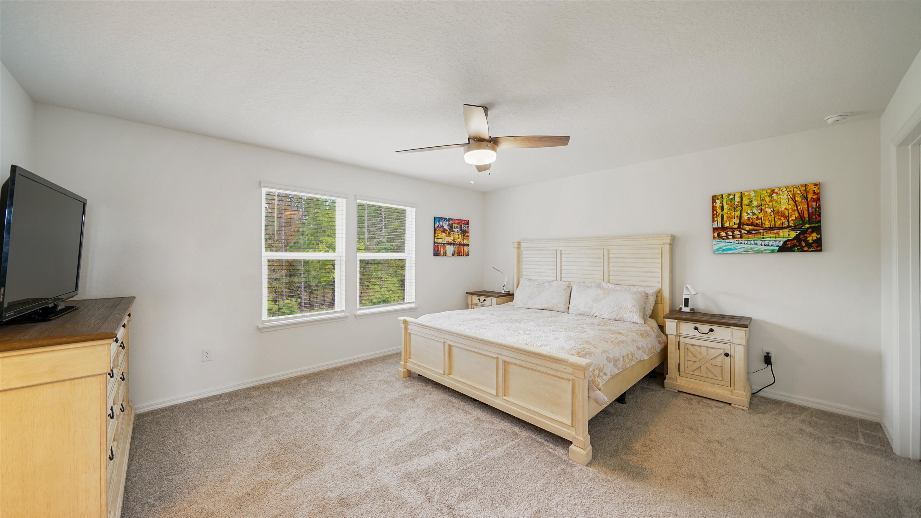 314 Red Barn Road St. Augustine, FL 32092 - Photo 21 of 45 a spacious bedroom with a bed and a flat screen tv