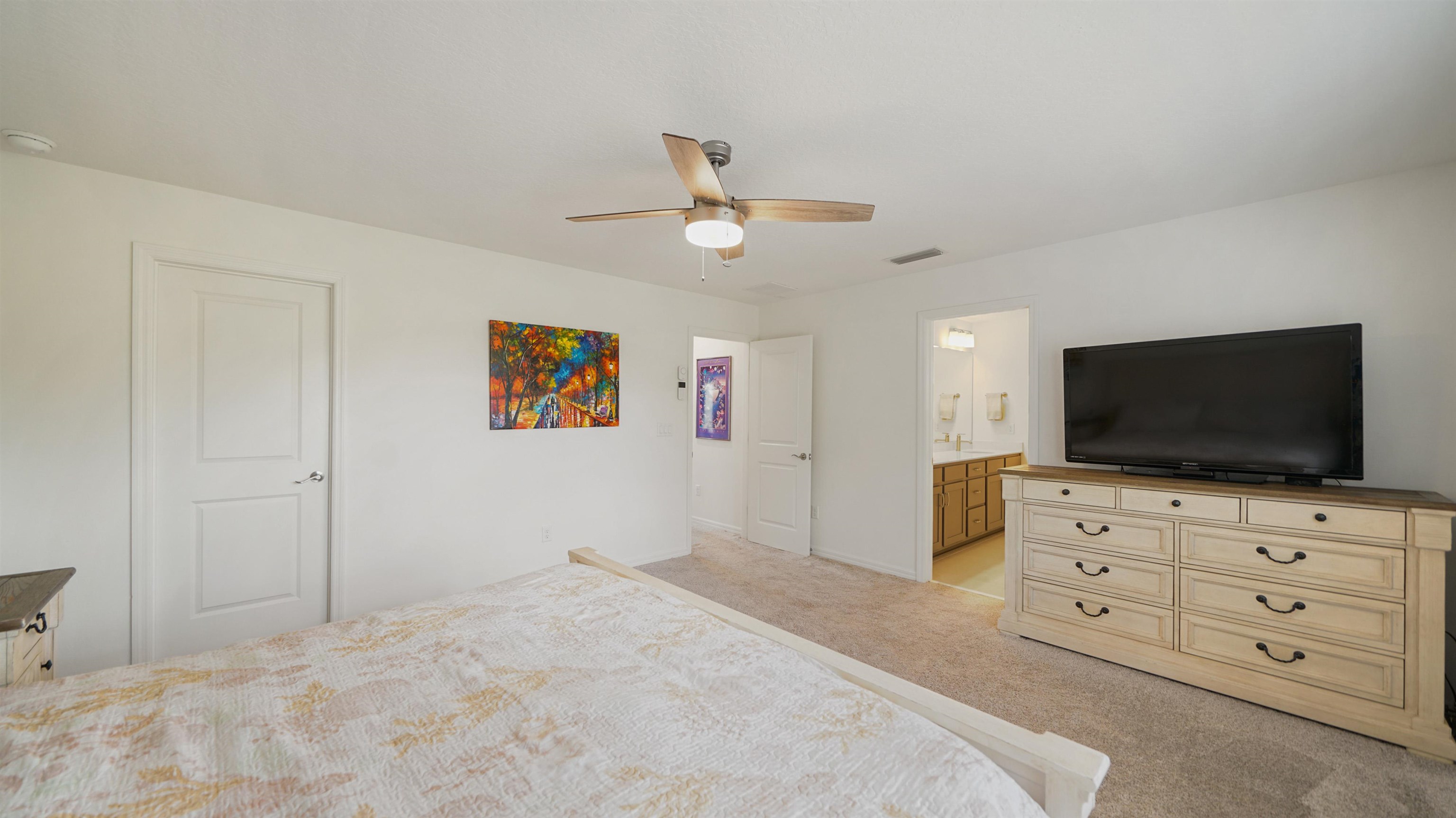 314 Red Barn Road St. Augustine, FL 32092 - Photo 22 of 45 a bedroom with a bed and a flat screen tv