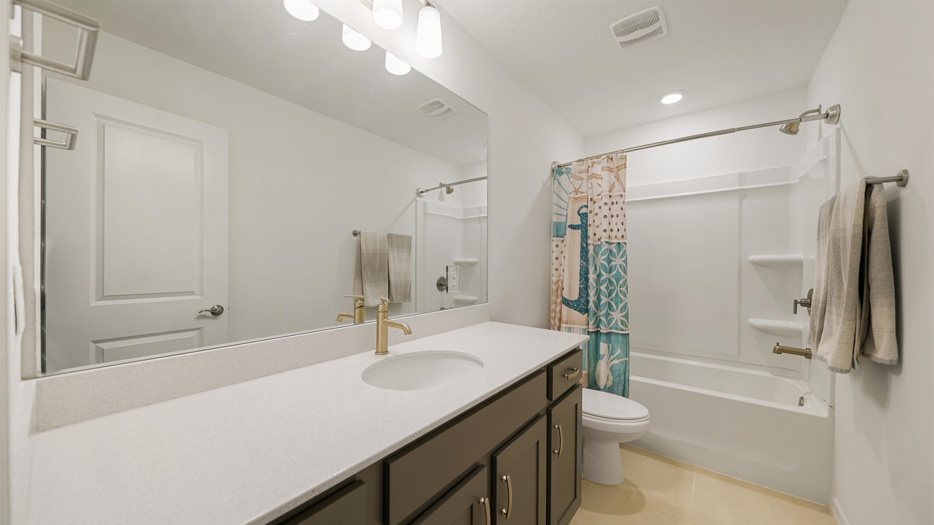 314 Red Barn Road St. Augustine, FL 32092 - Photo 27 of 45 a bathroom with a shower sink vanity mirror and toilet