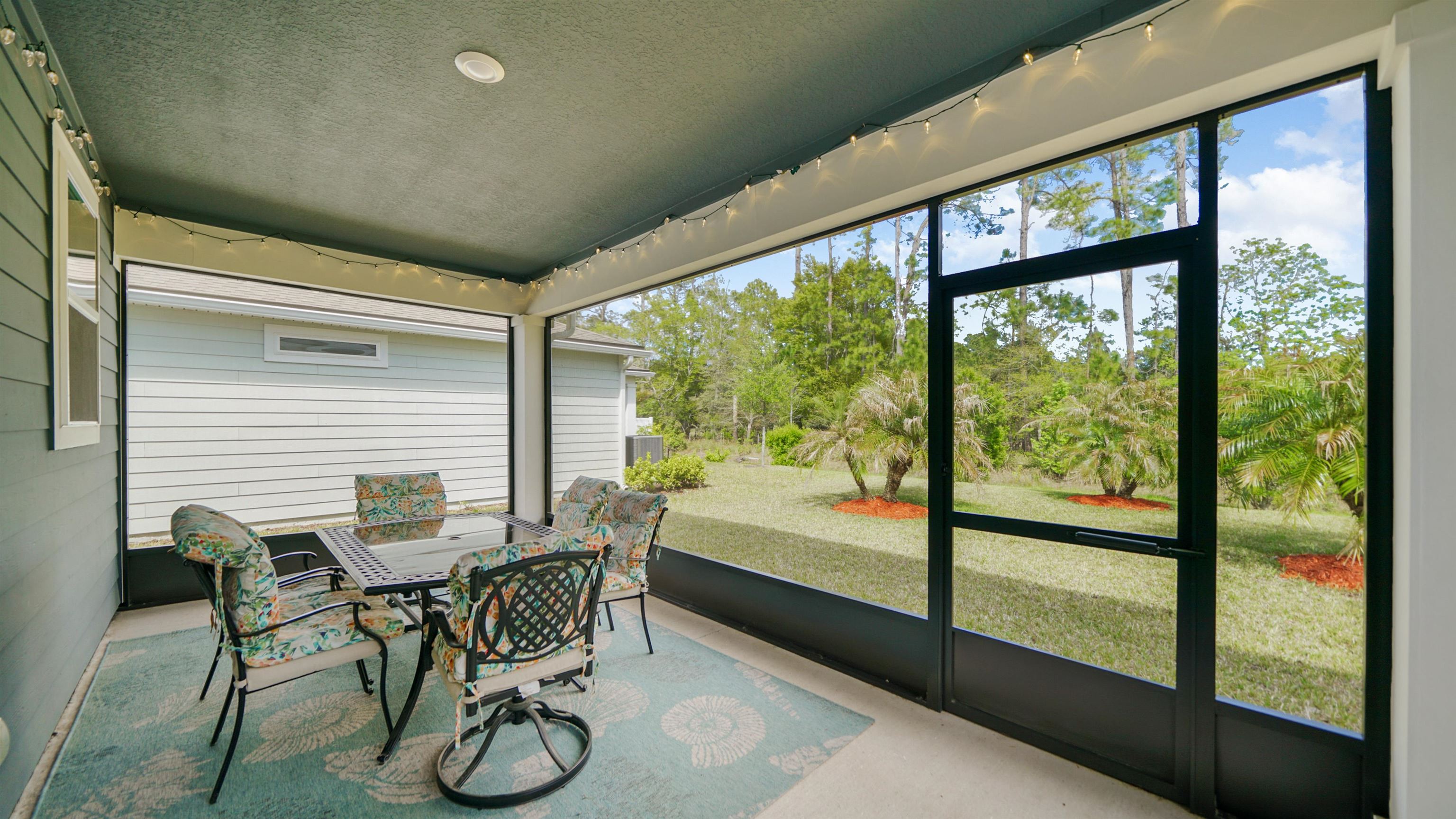 314 Red Barn Road St. Augustine, FL 32092 - Photo 30 of 45 a dining room with furniture and floor to ceiling window