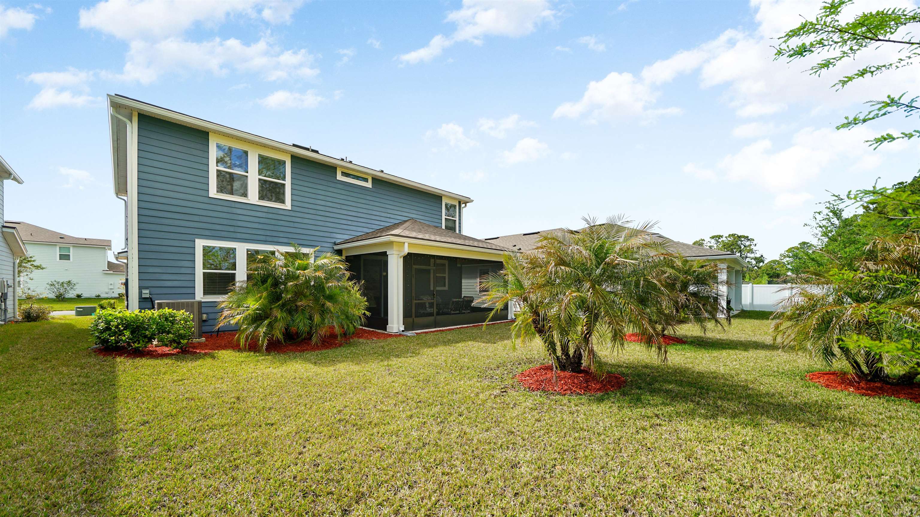 314 Red Barn Road St. Augustine, FL 32092 - Photo 33 of 45 a front view of a house with garden