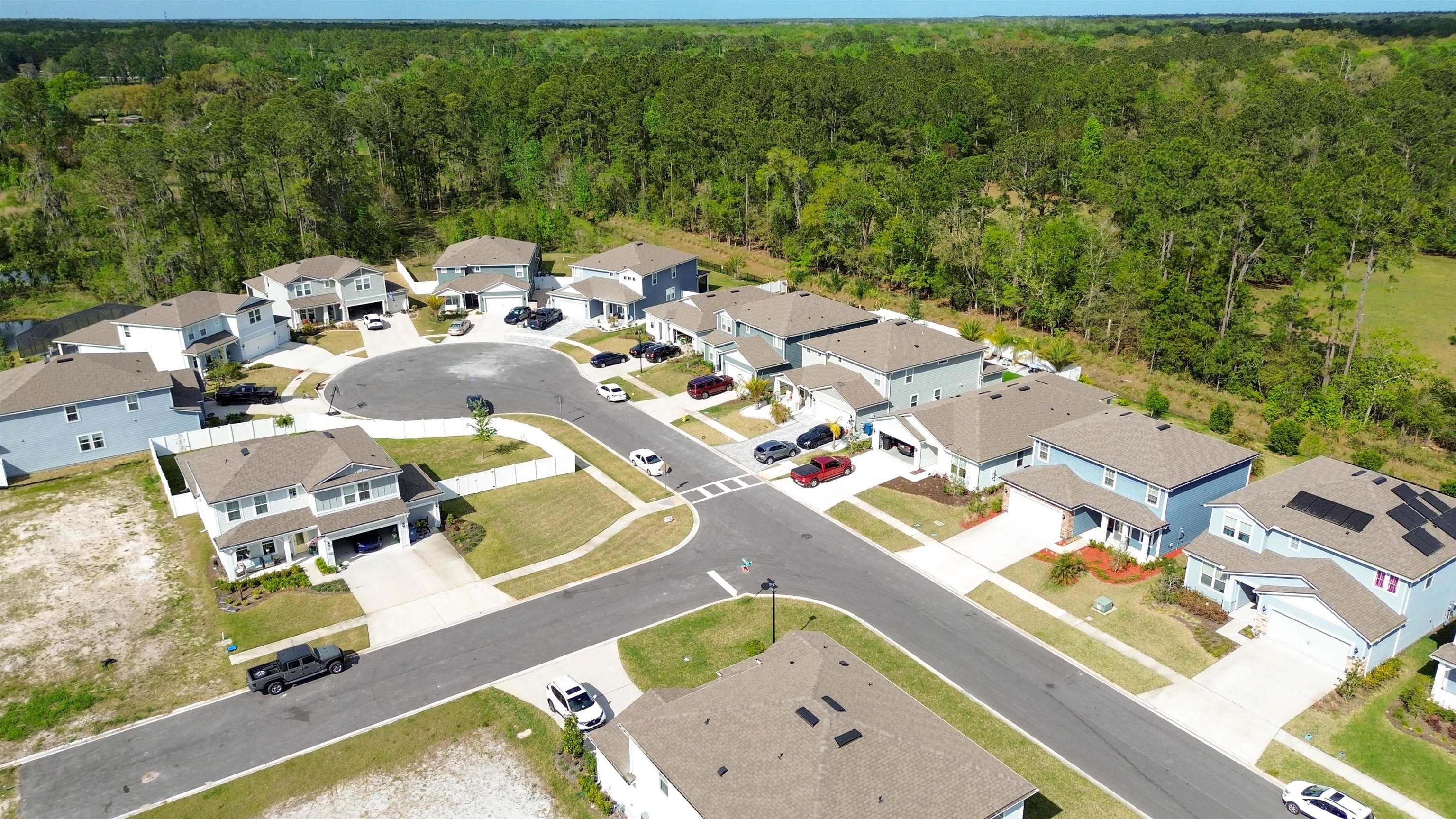 314 Red Barn Road St. Augustine, FL 32092 - Photo 37 of 45 an aerial view of a swimming pool with lawn chairs and large tree