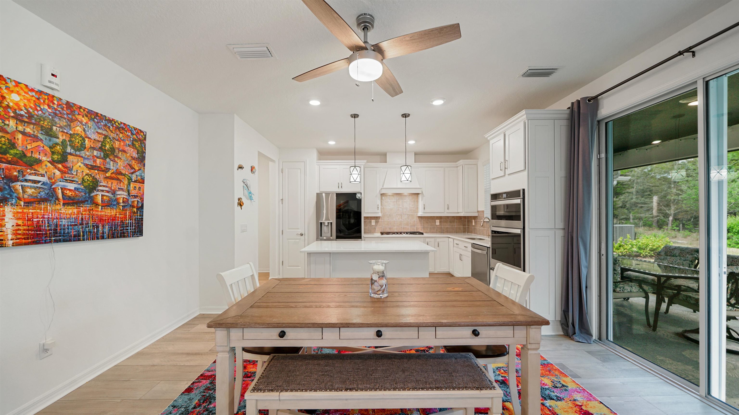 314 Red Barn Road St. Augustine, FL 32092 - Photo 5 of 45 a kitchen with kitchen island a stove and a view of living room