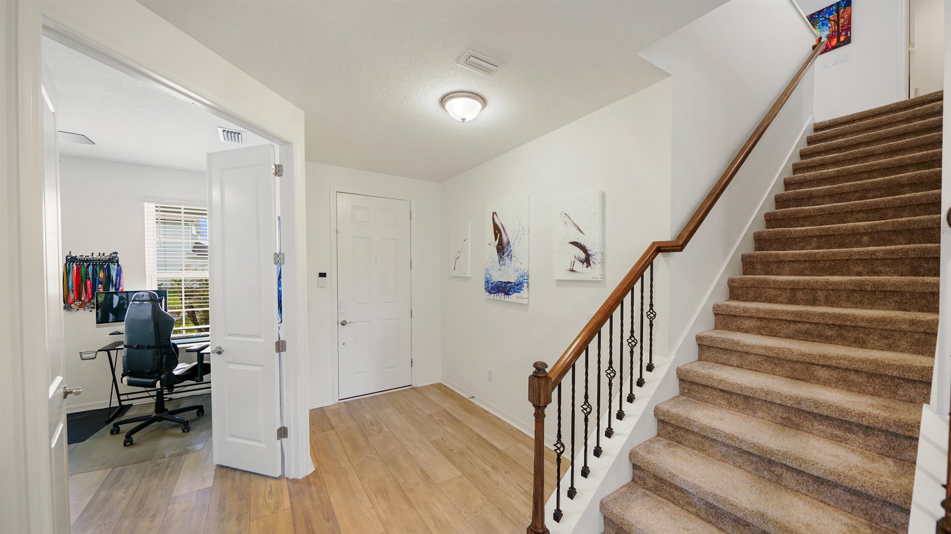 314 Red Barn Road St. Augustine, FL 32092 - Photo 9 of 45 a view of entryway with wooden floor and stairs