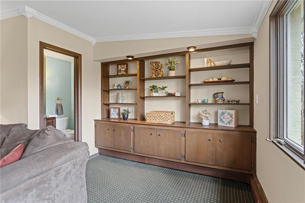 637 Ravencrest Road Pittsburgh, PA 15215 - Photo 17 of 41 built in shelves and a half bathroom off the family room.
