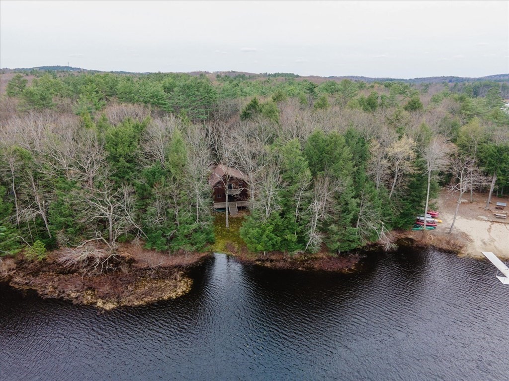 68 Jowders Cove Road Rindge, NH 03461 - Photo 1 of 22 a view of a lake with a mountain