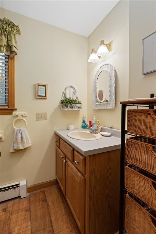 68 Jowders Cove Road Rindge, NH 03461 - Photo 13 of 22 a bathroom with a sink and a mirror