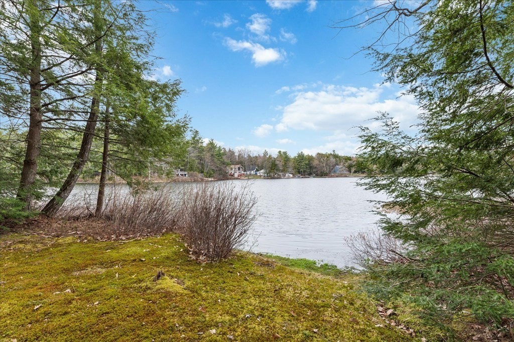 68 Jowders Cove Road Rindge, NH 03461 - Photo 5 of 22 a view of a lake from a yard