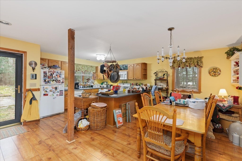 68 Jowders Cove Road Rindge, NH 03461 - Photo 9 of 22 a view of a dining room with furniture