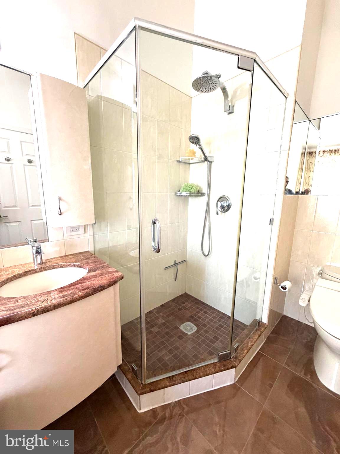 2703 Sterling Road Yardley, PA 19067 - Photo 31 of 41 Sleek glass shower with modern fixtures.