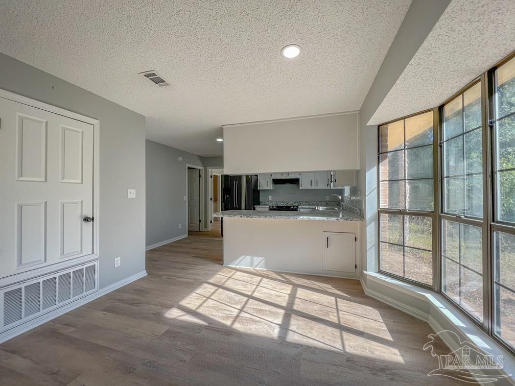 4285 Dana Street Pace, FL 32571 - Photo 5 of 26 a view of kitchen with windows